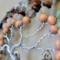 wood beads strung on silver color wire twisted into branches of the tree